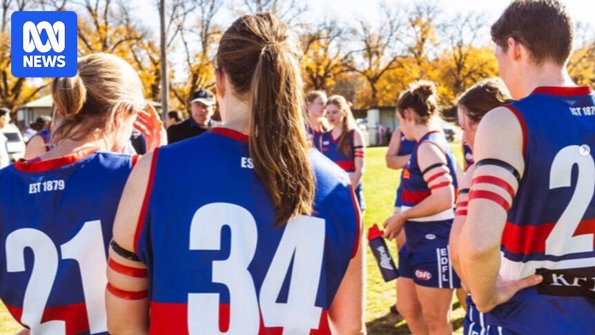 Football players carrying the red armbands protest women in the sport program cuts
